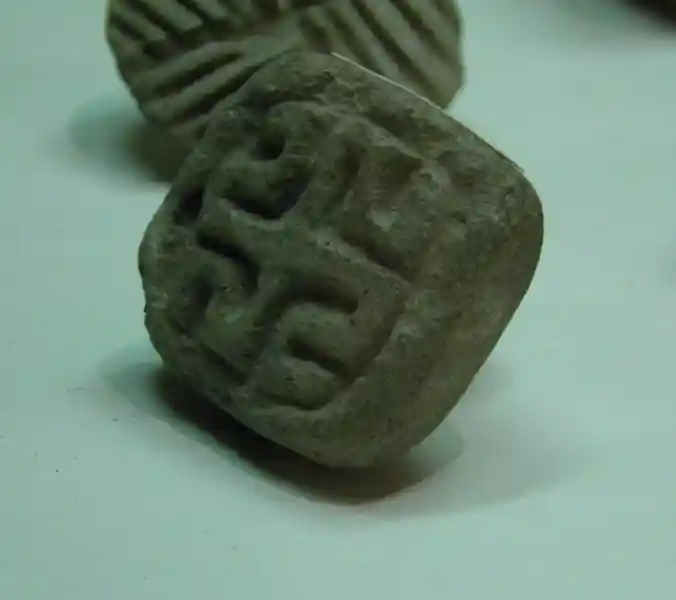 Swastika with extended arms engraved on a stone